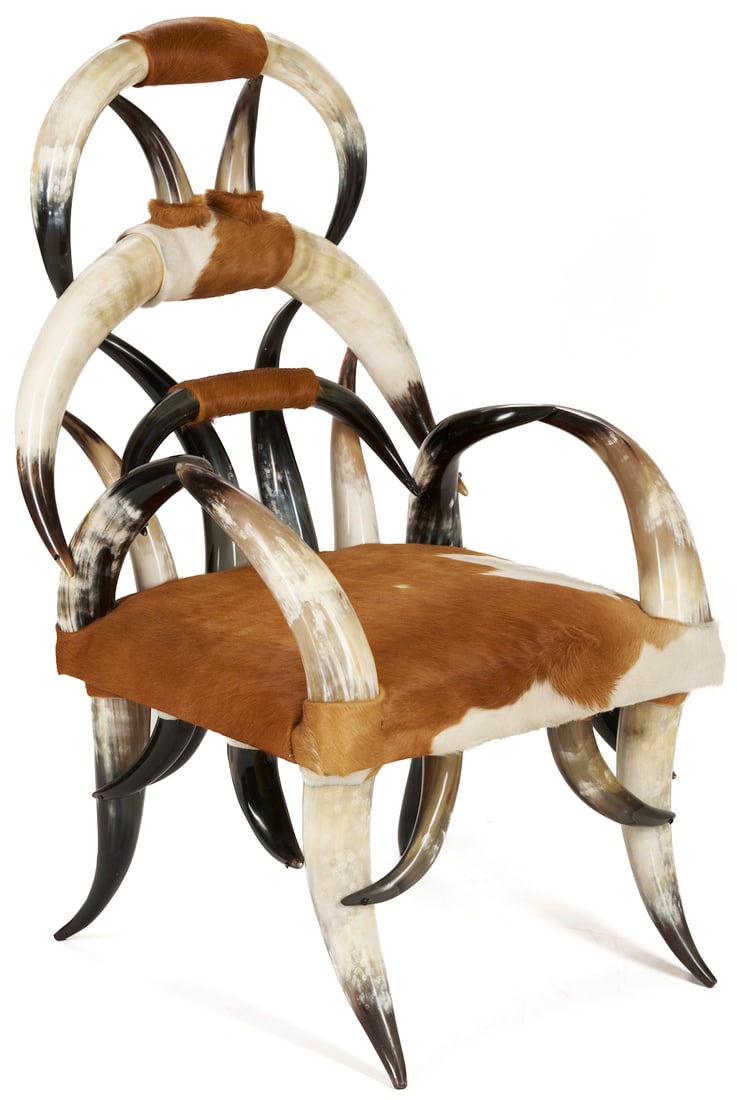 American Steer Horn Chair: Southern highback steer horn armchair in the manner of William Mittmann, comprised of over 25 horns and featuring a cowhide upholstered seat. 46 1/4 in. H x 25 1/2 in. W x 22 1/4 in. D. Probably