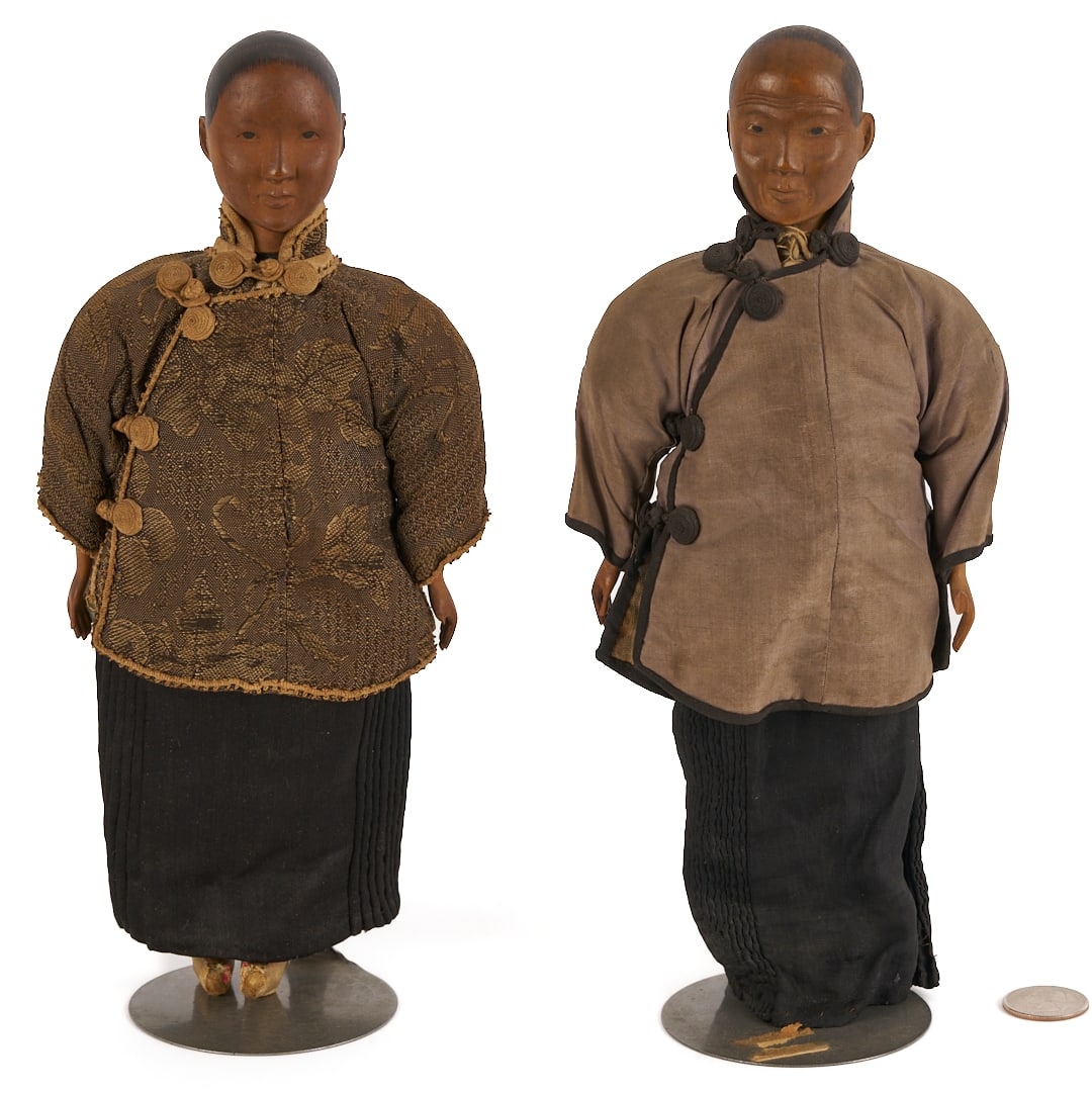 Two Chinese Door of Hope Dolls: Pair of two (2) Chinese "Door of Hope" Mission Dolls, each with finely detailed carved heads and hands, handmade traditional silk coats and skirts, and pointed silk shoes, supported on