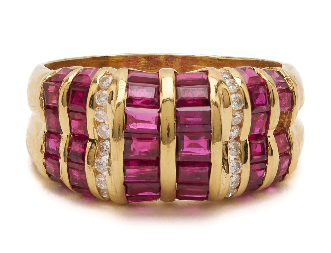 18K Gold, Ruby & Diamond Ring: Ladies' 18K yellow gold ring featuring thirty-seven (37) natural baguette rubies channel set accented by sixteen (16) round brilliant cut melee diamonds. The ring is marked "18K" and XRF tests 18K