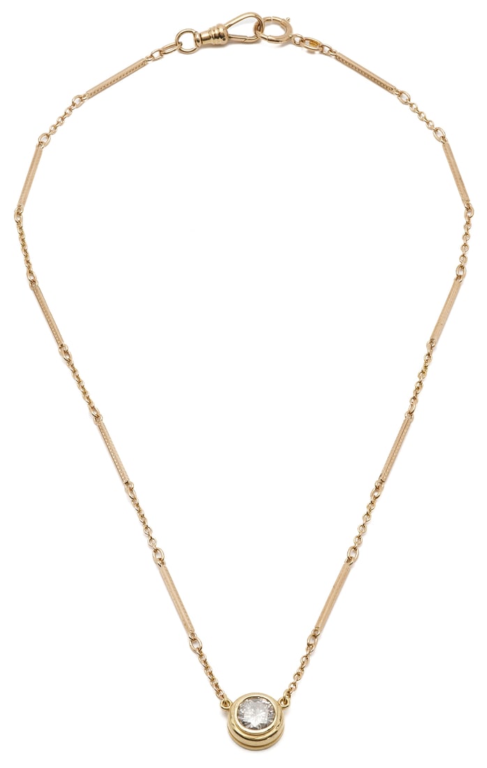 10K Yellow Gold Watch Chain & Diamond Pendant Necklace: Ladies' custom 10K yellow gold watch chain necklace featuring a 14K yellow gold bezel with one (1) round brilliant cut diamond, approximately 1.60 carats, Clarity I2, color I. The necklace is