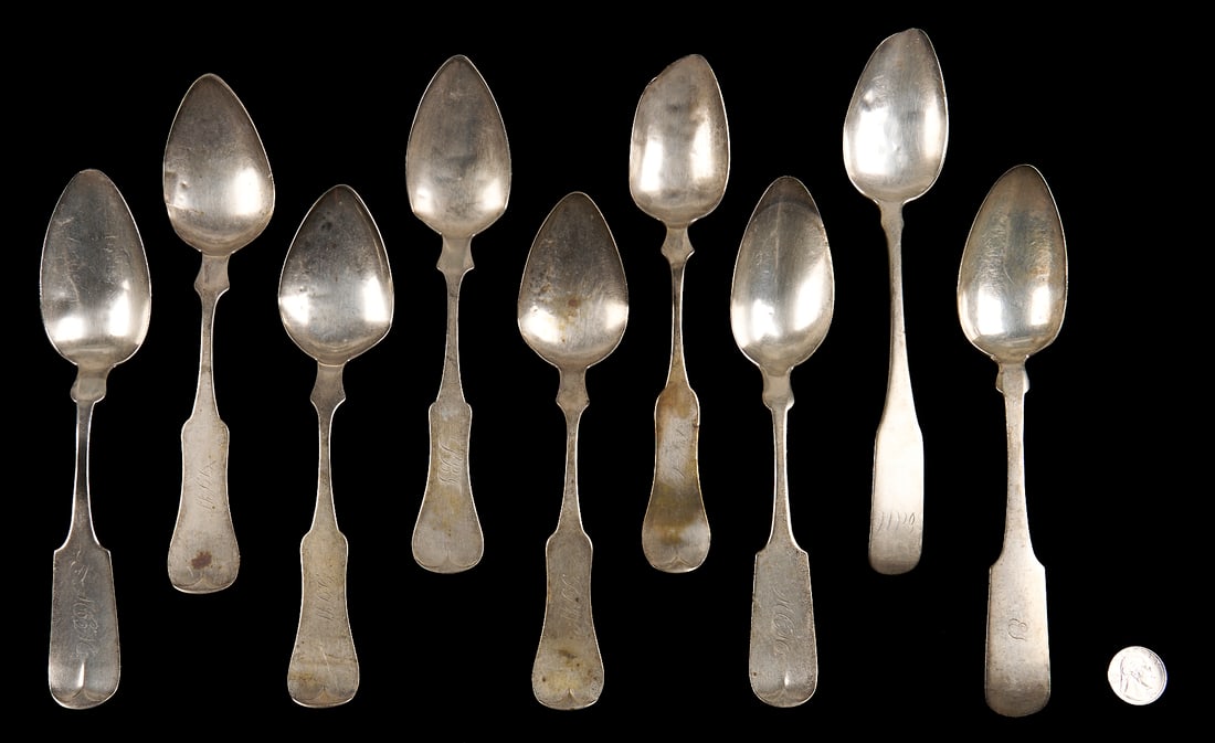 9 Coin Silver Spoons Incl. Alabama: Grouping of nine (9) assorted mid 19th century coin silver table/serving spoons, including: 2 fiddle tipt handle spoons with incuse marks for retailers Albert J. and F. A. Leslie (working Mobile, Alab
