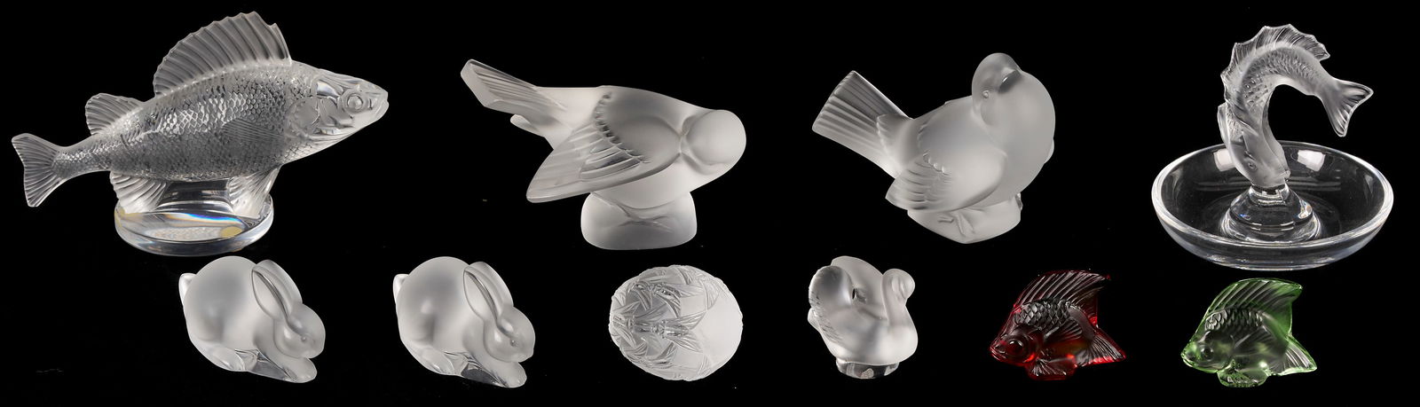 10 Lalique Glass Table Items, mostly Animals: Ten (10) assorted Lalique crystal figurines, clear and colored, including 1 Cicadas egg figure, 1 clear fish paperweight, 1 clear fish ring or pin holder, 2 frosted bird figures, 2 frosted bunny