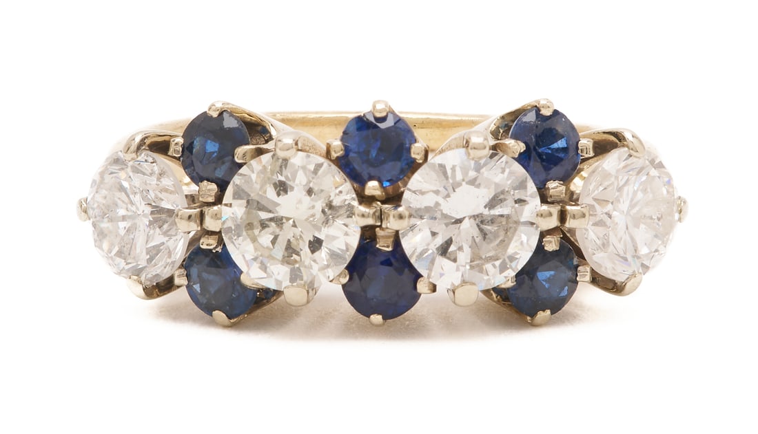 14K Yellow Gold Diamond & Sapphire Line Ring: Ladies' 14K yellow gold line ring featuring four (4) round brilliant diamonds approximately 1.74 carats together, Clarity-I1, Color-I, accented by six (6) natural round cut sapphires. The ring is