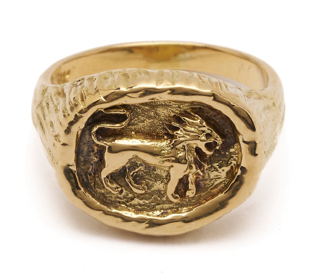 18K Gold Tiffany & Co Lion Signet Ring: Ladies' 18K yellow gold signet ring featuring a lion image. The ring is marked "18K Tiffany & Co Italy" and XRF tests 18K gold. The ring is size 5 1/2 and has a weight of 7.80 grams.