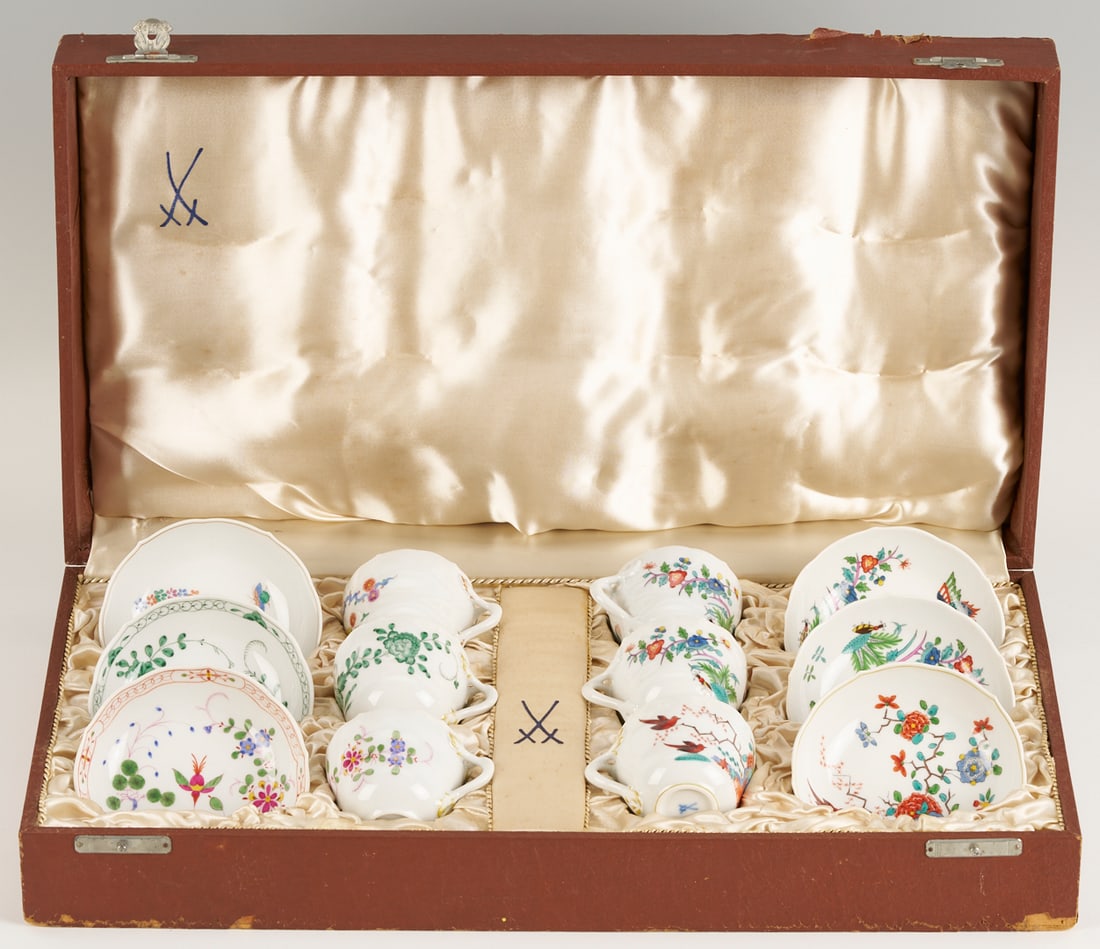 6 Meissen Demi Tea Cups & Saucers w/ Original Box: Set of six (6) Meissen porcelain demi tea cups and saucers, each with unique Asian style decoration. All pieces with the blue crossed swords mark and incised numbers. The case interior additional