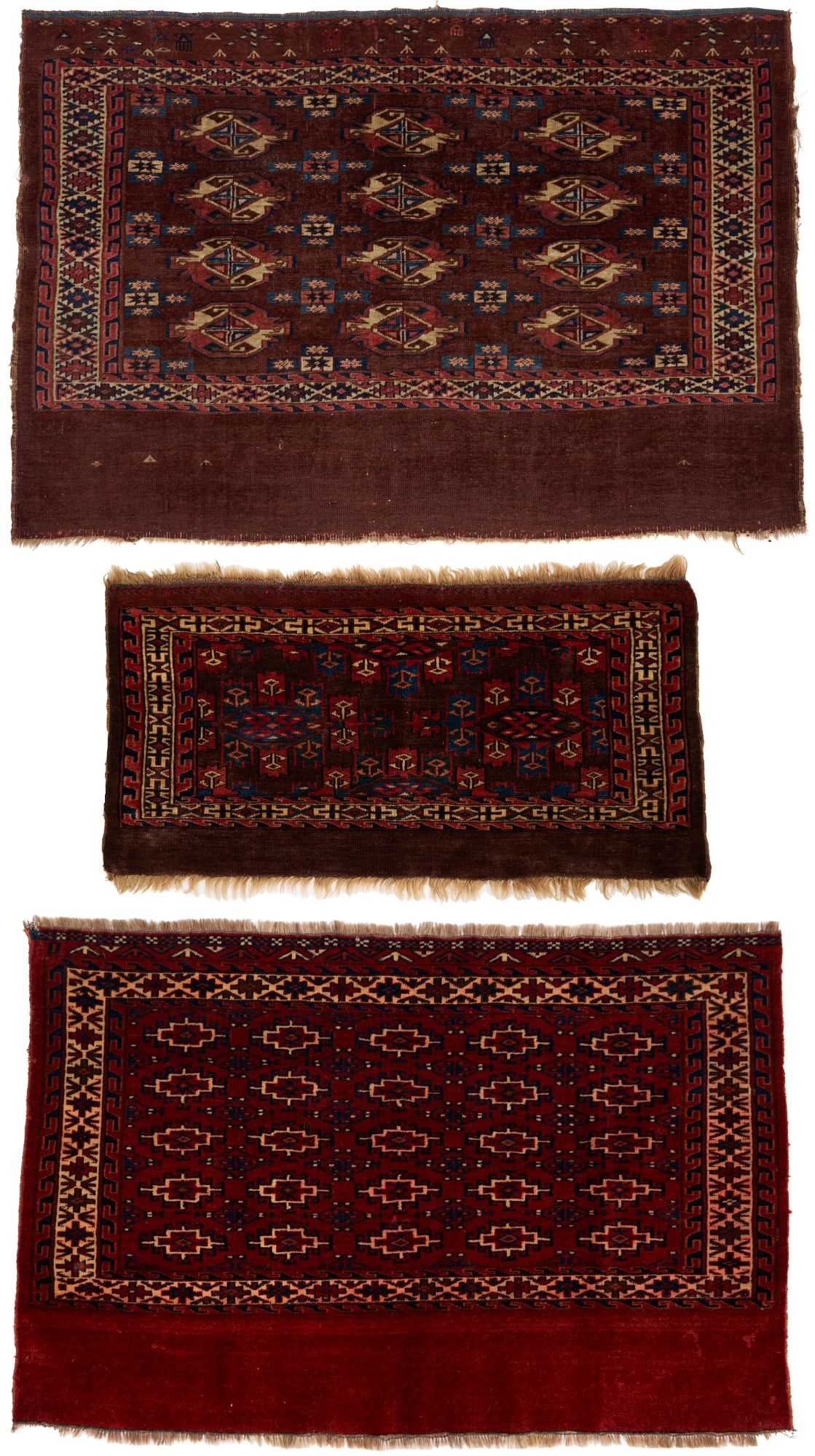 3 Antique Turkmen Tribal Weavings, incl.Chuvals and Torba: Three (3) antique Turkman tribal weavings, all wool on wool and woven in blue, red, and cream colors, including: a Yomud Chuval with three rows of four guls and a plain lower elem panel, 3 f