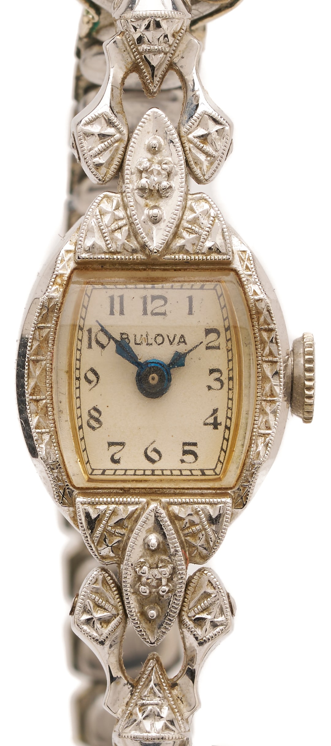 14K Gold Bulova Watch: Ladies 14K white gold Bulova wrist watch featuring two (2) single cut melee diamonds. The watch case is marked "14K" and XRF tests 14K gold, while the band is a base metal. The watch is 7 in