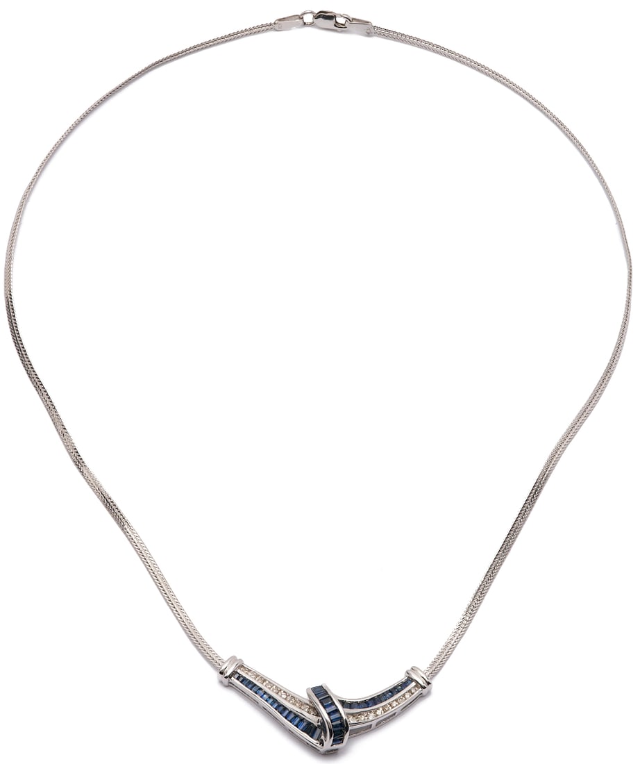 10K Gold, Diamond, & Sapphire Necklace: Ladies' 10K white gold necklace featuring twenty-two (22) single cut melee diamonds and thirty-seven (37) synthetic baguette cut sapphires. The necklace is marked "10K Italy ADL" and XRF
