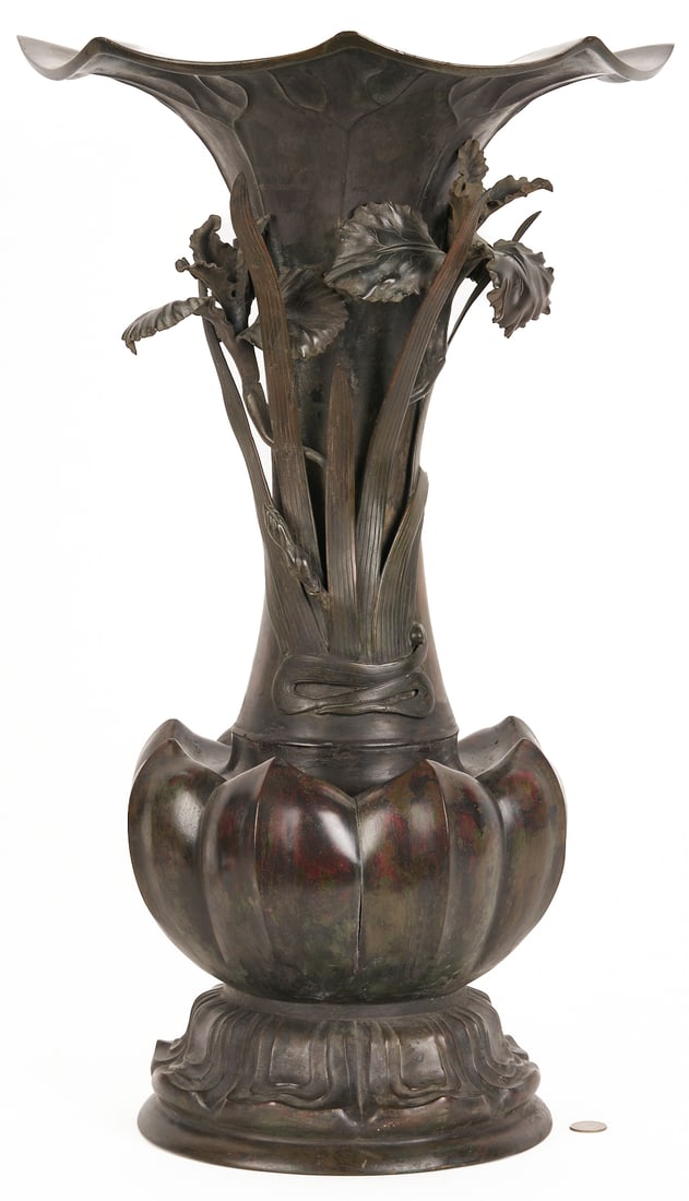 Japanese Meiji Bronze Iris Vase: Large Japanese Meiji bronze vase, lobed baluster form with flaring rim, iris relief decoration to the body, and a stylized lotus blossom base. 27 in. H x 16 1/4 in. dia. Late 19th/Early 20th century. 