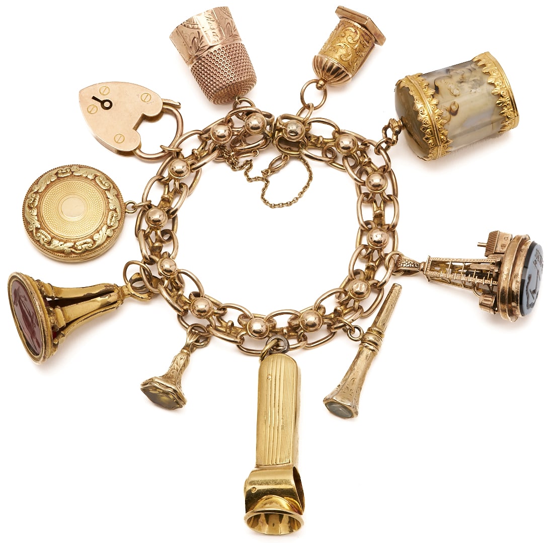 Victorian 10K Yellow Gold Charm Bracelet w/ 10 Charms: A Victorian 10K yellow gold charm bracelet (XRF tested) with illegible mark having 10 assorted charms, including: an English 9K heart padlock with maker's mark W. J. S.; an 18K locket with pr