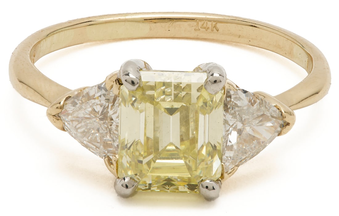 14K & Platinum 2 Carat Fancy Yellow Diamond Ring, GIA Report: Ladies' 14K and platinum three-diamond ring featuring a 2.01 emerald-cut natural fancy intense yellow diamond, SI1 clarity, measuring 7.69 x 6.37 x 4.70mm, good Polish, good symmetry, and faint fl