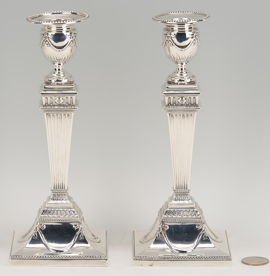 J & H Savory - Pair of English Sterling Silver Candlesticks: Pair of English Neoclassical style sterling silver candlesticks, hallmarked JSH for Joseph & Horace Savory, London, England. Urn shaped candle cups with beaded edges and laurel and swag decor