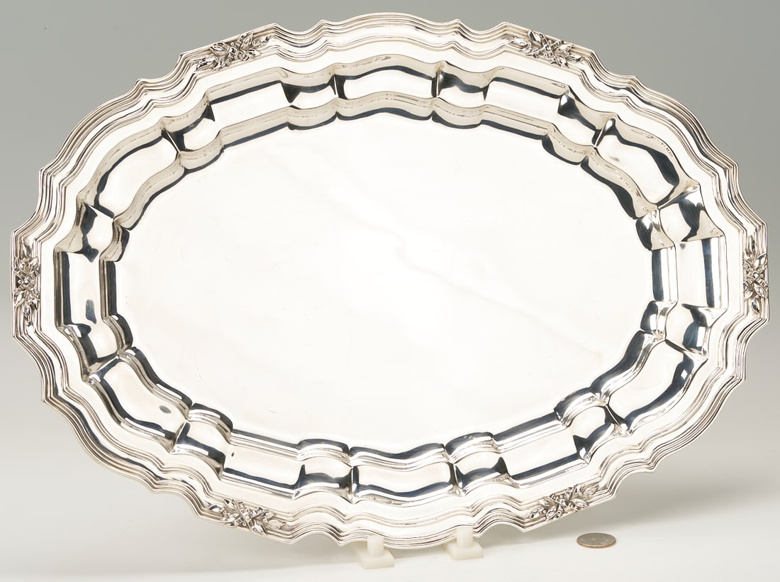 Sterling Silver Oval Tray, Bailey Banks & Biddle: Sterling silver oval tray with reeded scalloped border accented with leaf and ribbon motifs, stamped on underside BAILEY BANKS AND BIDDLE STERLING / 804 18 IN. Measures 18 3/4 in x 13 in. Weight 51.82