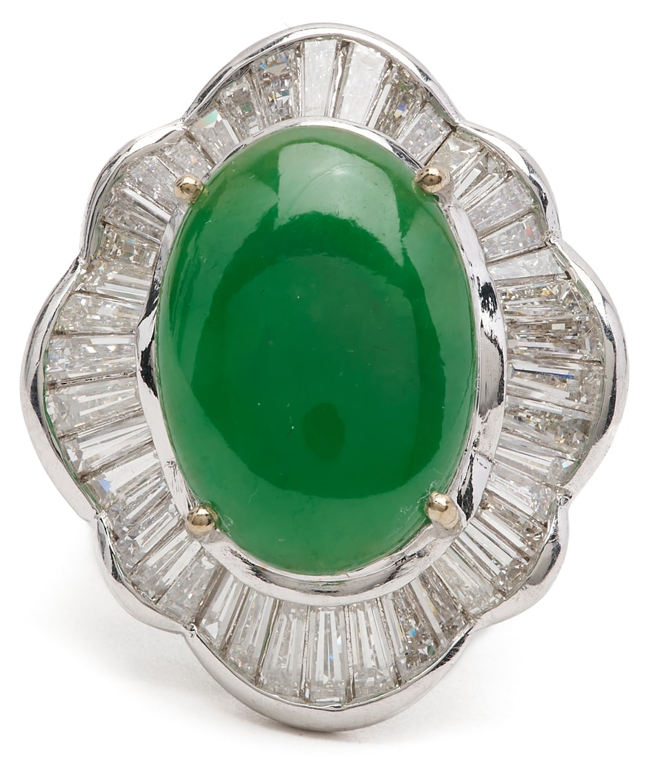 18K White Gold Jadeite & Diamond Ballerina Ring: 18K white gold jadeite and diamond ballerina ring featuring one (1) oval green jadeite cabochon measuring approximately 18 x 13 mm and forty-two (42) tapered baguette diamonds approximately 4.25 carat