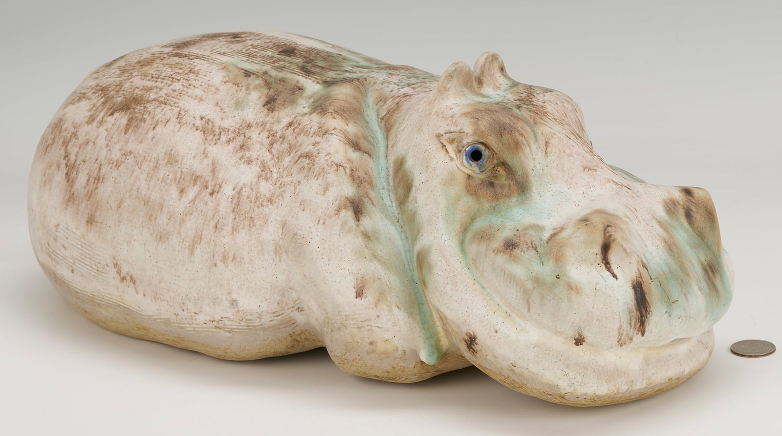 McCarty Pottery Hippopotamus Figurine, Merigold, Mississippi: Large Hippopotamus pottery figurine by McCarty Pottery of Merigold, Mississippi, with four-tone glaze and cobalt eyes. Inscribed “McCarty P / Merigold / Miss” to the underside. 15 1/2 in.