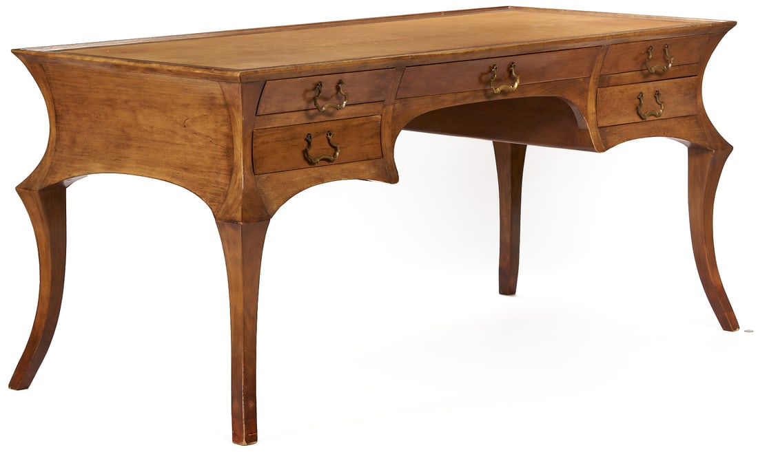 Rose Tarlow Designer French Style Desk: 20th century designer Rose Tarlow French style desk of angular bombe form, featuring a rectangular lipped top with inset leather writing surface, and a central long drawer flanked on each side by
