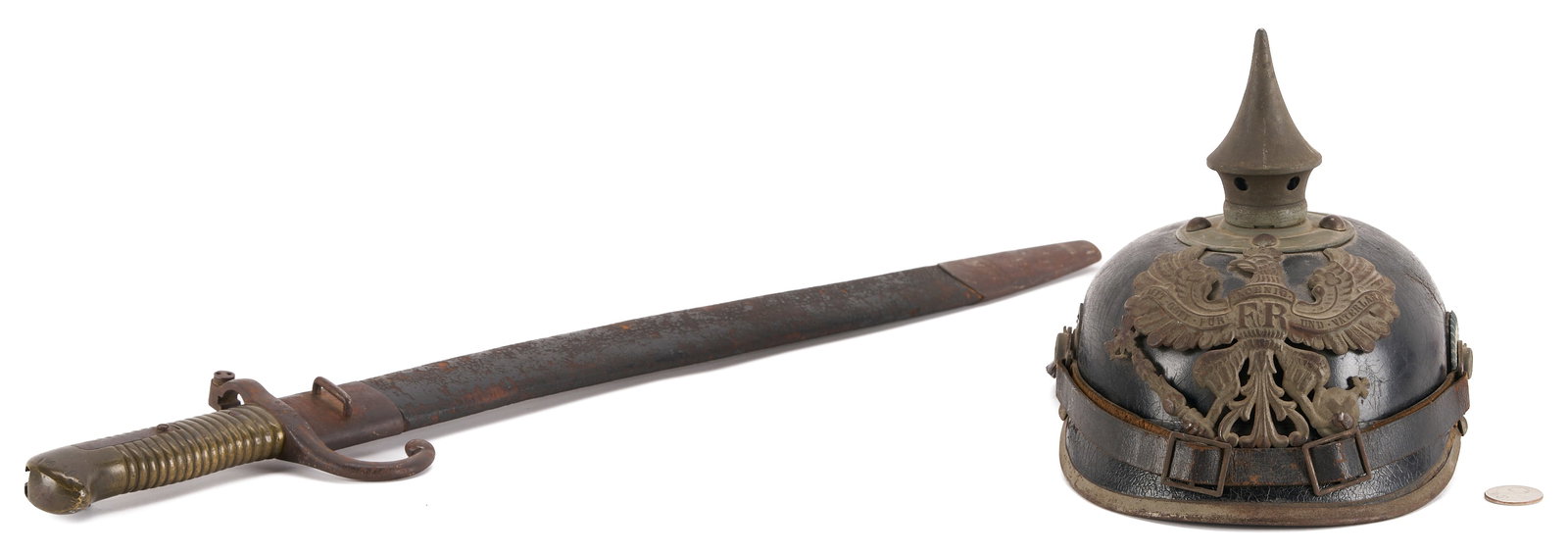 German/Prussian Bayonet & Military Helmet: 1st Item: Belgian Model 1880 Engineers' sawback bayonet in leather scabbard. Straight blade with wide fullers, brass ribbed grip, "Crown over FL" proofs on ricasso and bottom of gri
