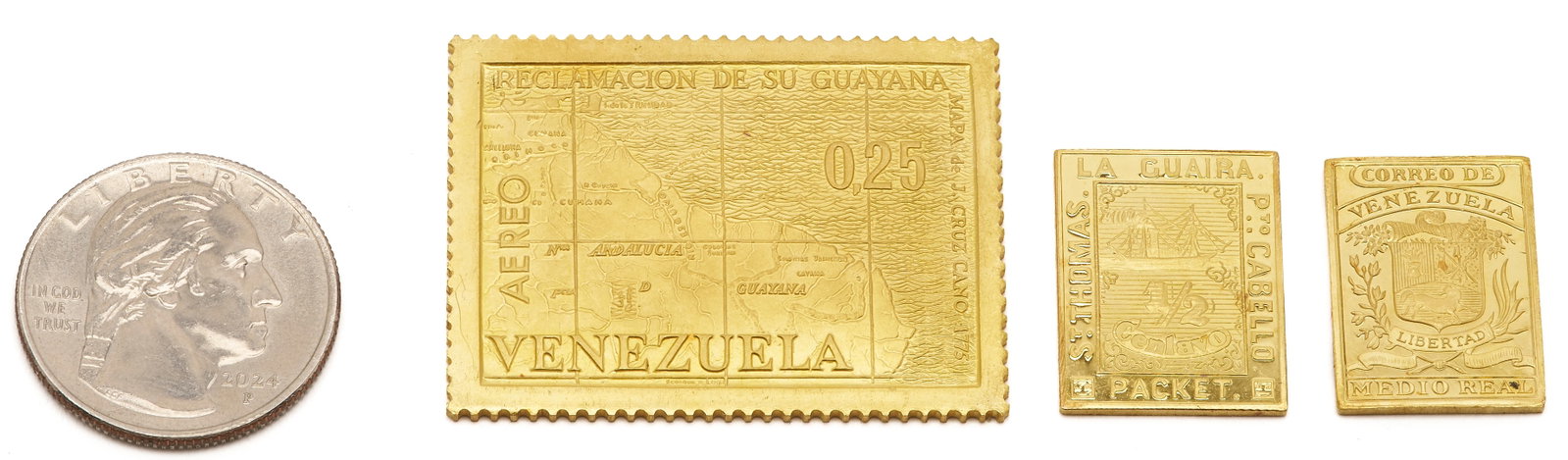 3 Venezuela 22K Gold Replica Stamps: 1st item: 22K yellow gold Venezuela stamp replica of a 1964 postage stamp honoring the Guayana territory claim. Marked "AEREO" along the left side, "VENEZUELA" along the bottom, an