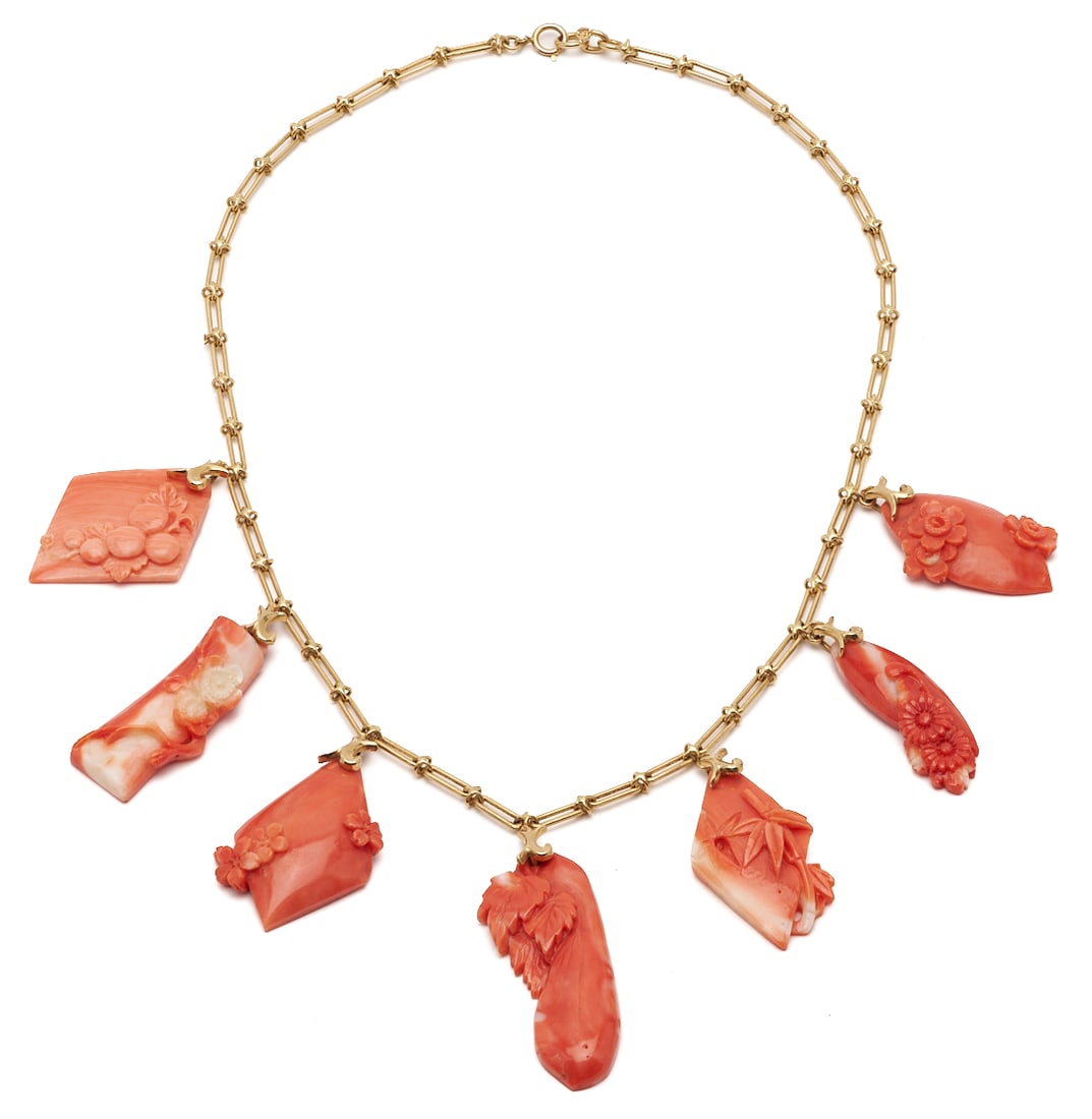 15K Yellow Gold & Coral Art Nouveau Inspired Pendant Necklace: 15K yellow gold and coral Art Nouveau-inspired pendant necklace featuring reddish-orange coral carved with seven floral motifs of varying shapes and sizes. Suspended from a handmade link chain measuri