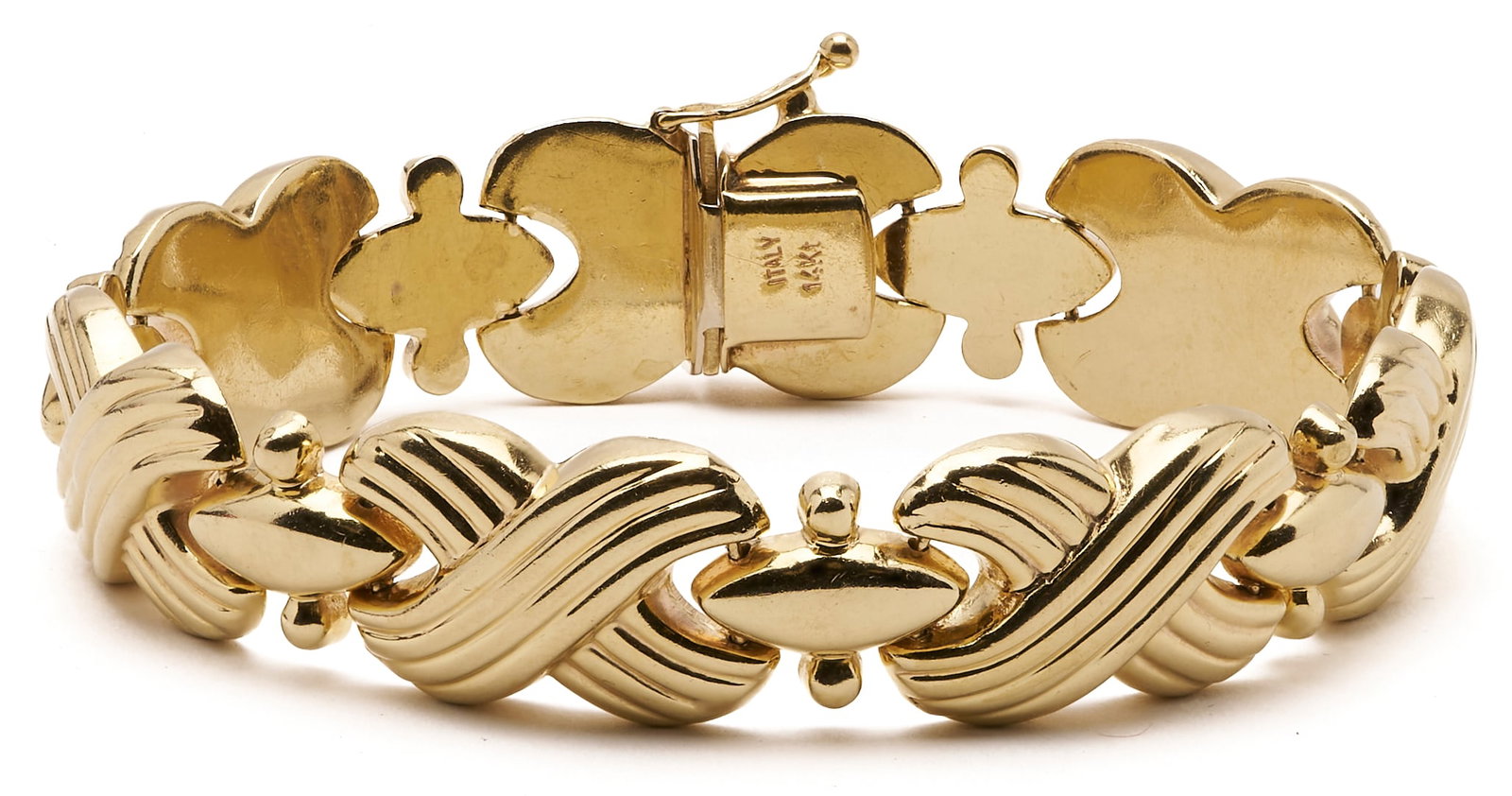 Italian 14K X-Link Bracelet: Ladies' vintage Italian 14K yellow gold bracelet featuring fluted "X" link designs. Marked ITALY and 14K. XRF tests 14K. 7 3/4 in. L. 22.62 grams. Additional high-resoluti