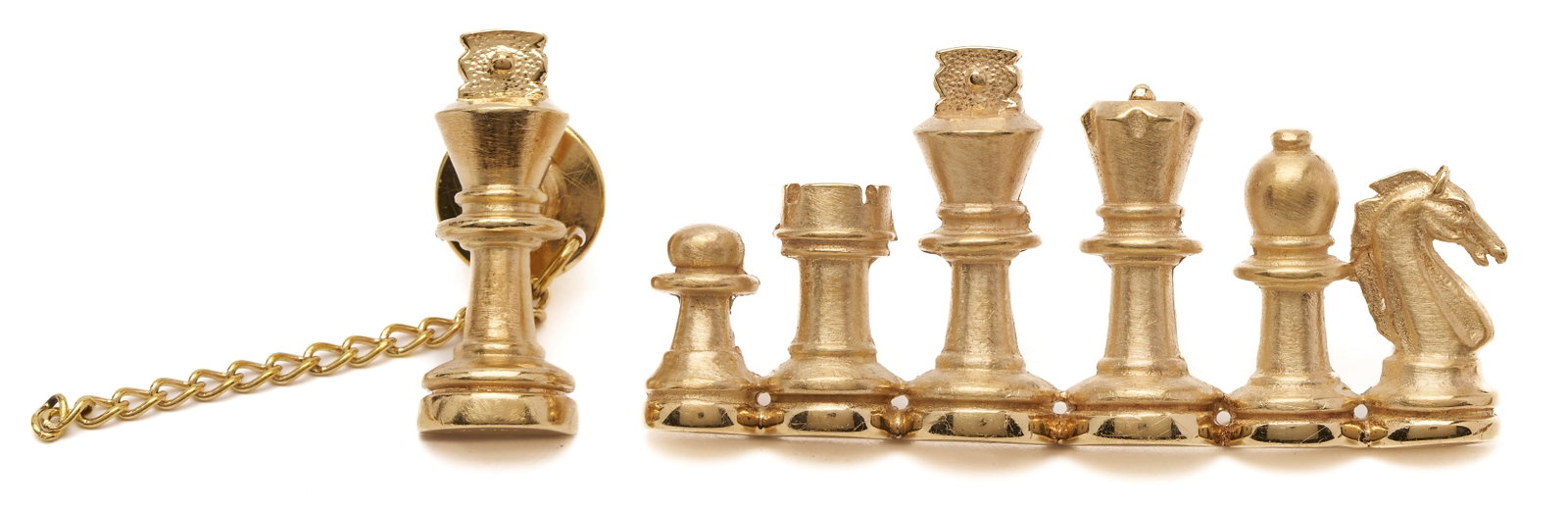 A. Gilbert 14K Chess Bar Brooch & 14K Chess King Pin: 1st item: M. Silber 14K yellow gold bar pin featuring chess pieces. Marked "M. Silber 14K". 2 in. L. 2nd item: M. Silber 14K yellow gold chess piece in the form of a king. Ma