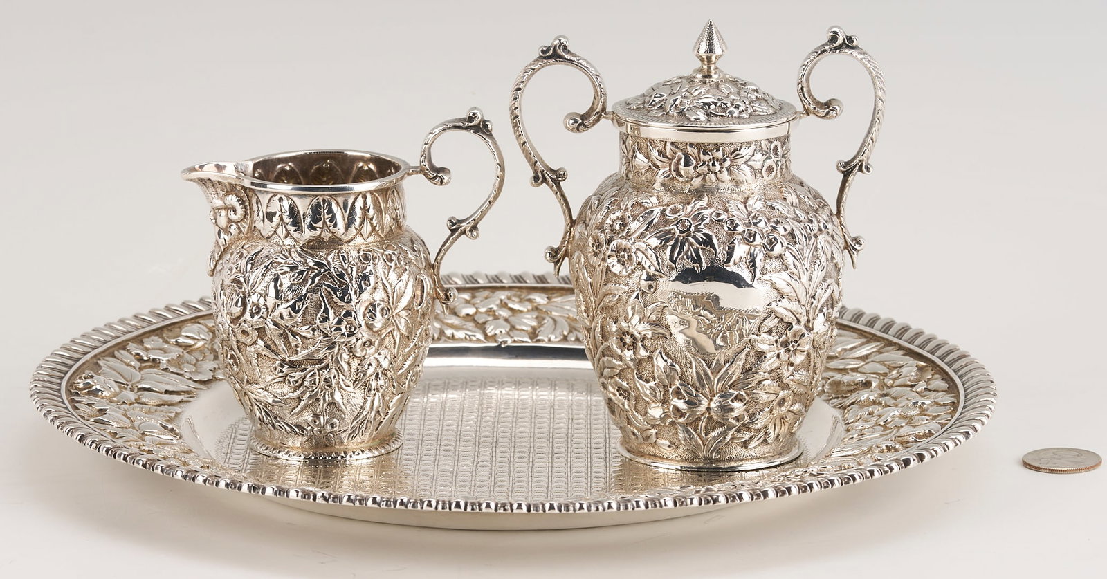 Sterling Bailey Banks Biddle Tray plus Justice & Arminger Cream/Sugar: 1st item: Bailey, Banks and Biddle sterling silver charger or small round tray with elaborate floral repousse and gadroon border and chased diaper center. Inscribed en verso "Helen and Leuvenigh 