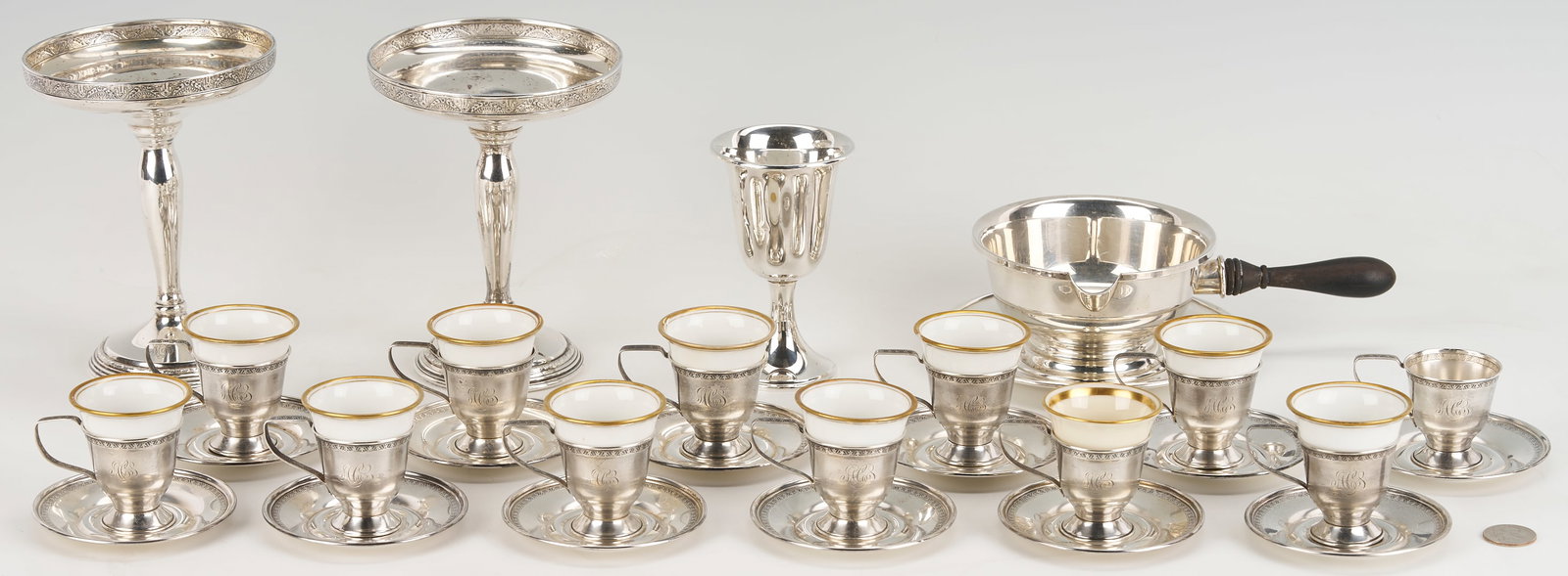29 Assorted Sterling Silver Items: Twenty-nine (29) assorted sterling silver items, including: 12 W. H. & Company demitasse cups and 12 saucers together with 11 assorted porcelain liners (German and Lennox); 2 E
