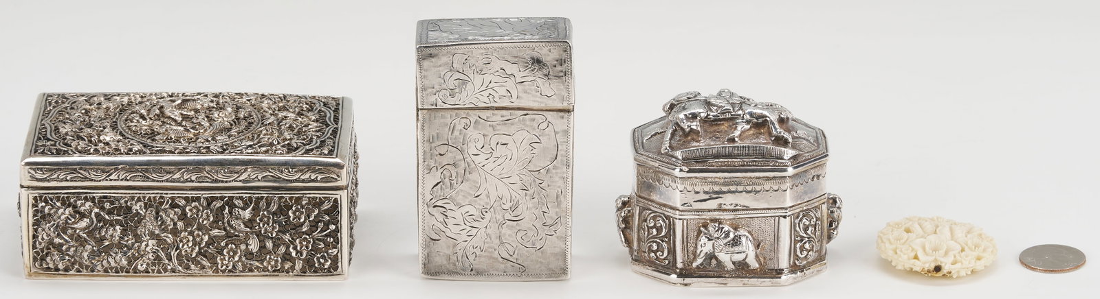 3 Asian Silver Boxes plus White Coral Carving: 1st item: Chinese or Southeast Asian silver trinket box with eight sides, each having raised floral, figural, or elephant decoration, and the lift-off top with raised warrior decoration. Worn hallmark
