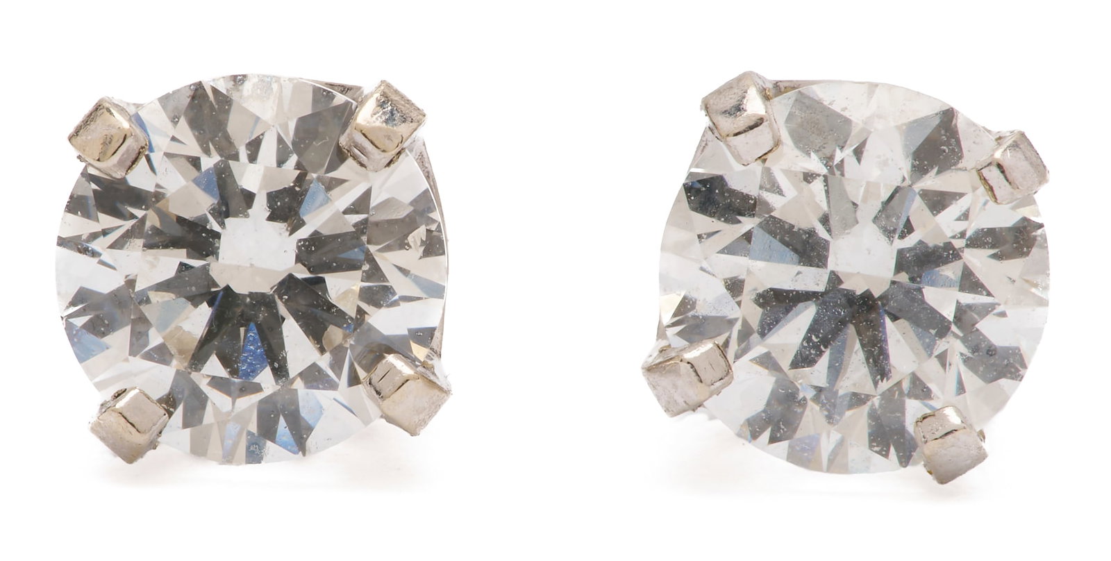 14K White Gold Diamond Stud Earrings: Pair of 14K white gold diamond stud earrings featuring round diamonds with an estimated total weight of approximately 0.84 carats, G color, SI1 clarity. 4.78 to 4.81 mm. Set in 14K white gold wit