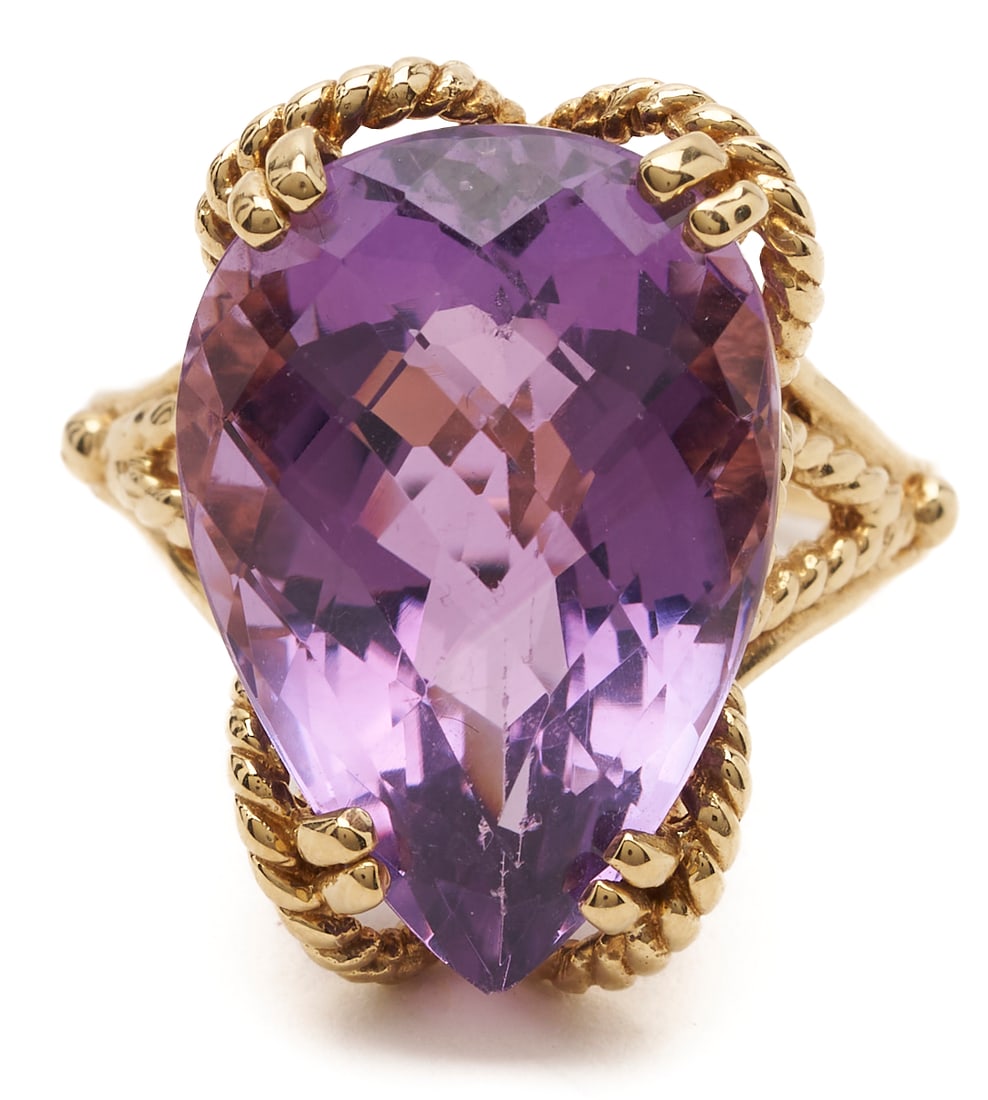 14K Pear Shaped Amethyst Ring: Ladies' 14K yellow gold ring featuring an approximately 15.88-carat pear-shaped amethyst with checkerboard faceting, set in a rope wire mounting. Ring size 9; total weight 9.4 grams. 