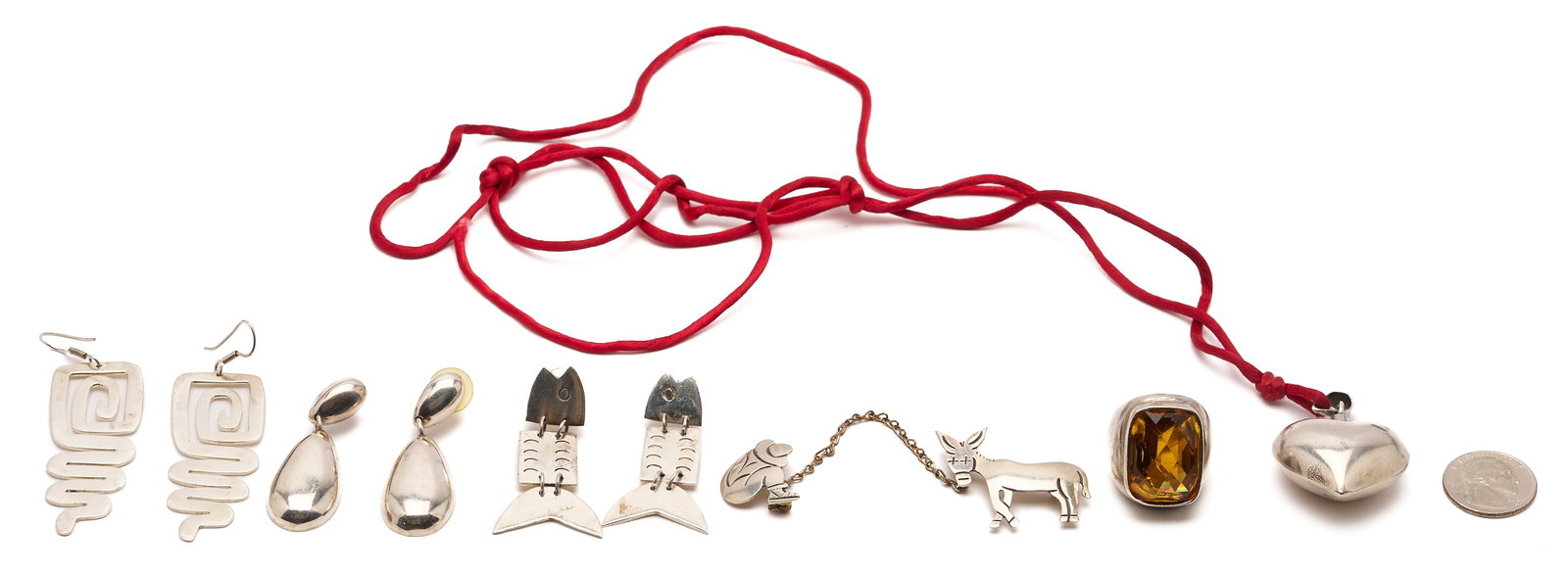 6 Sterling Silver Jewelry Items, mostly Mexican: Six (6) sterling silver jewelry items, including: a pair of Taxco geometric drop earrings; a pair of Taxco fish earrings; a Taxco heart pendant; a Marcelo donkey and rider brooch; a pair of drop