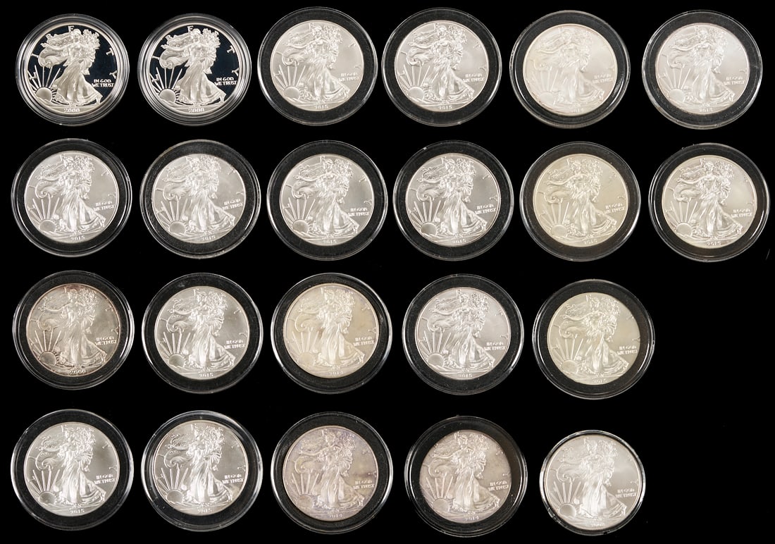 22 Assorted Silver Eagle $1 Coins: Twenty-two (22) assorted Silver Eagle $1 Coins including three (3) 2000 coins including two (2) in the original US Mint boxes, one (1) 2008, one (1) 2013, four (4) 2014, eleve