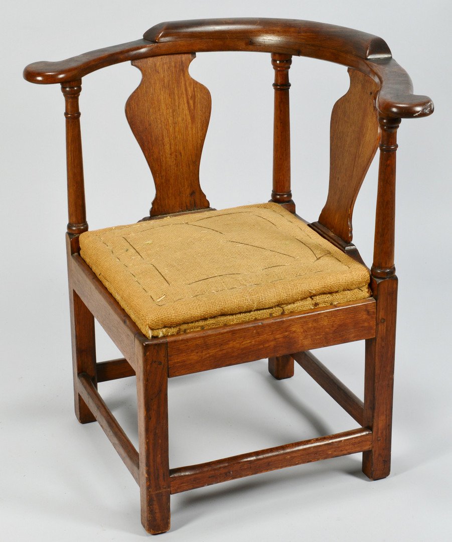 18th C. Corner Chair, Poss. VA: 18th century walnut corner chair, possibly Virginia. Broad D-shaped arm rail with applied low crest and rounded terminal rests, two vasiform splats, turned tapering column supports, square Marlborough