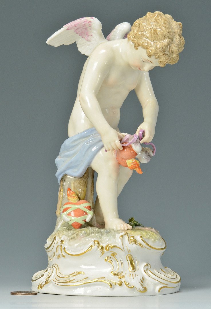 Meissen Figure: Cherub and Heart strings: Meissen allegorical porcelain figurine, a cherub or putto tying strings around a heart. Impressed blue underglaze crossed sword marks, impressed marks P139 and 111. 8"H. German, late 19th century. Pro
