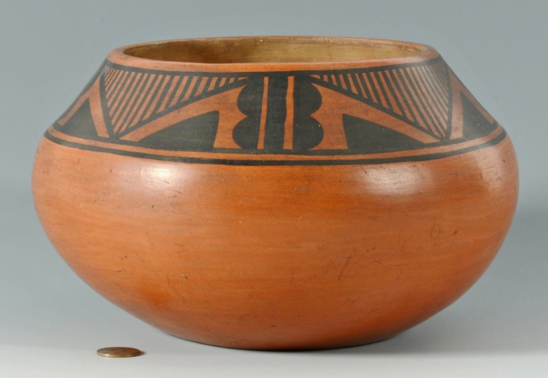 Tonita Roybal San Ildefonso jar with designs: Early Tonita Roybal (Tonita Martinez Roybal, 1892 - 1945) San Ildefonso black on red design jar, tapered shoulder with painted geometric triangular and wing designs, ovoid tapered base. Incised signat