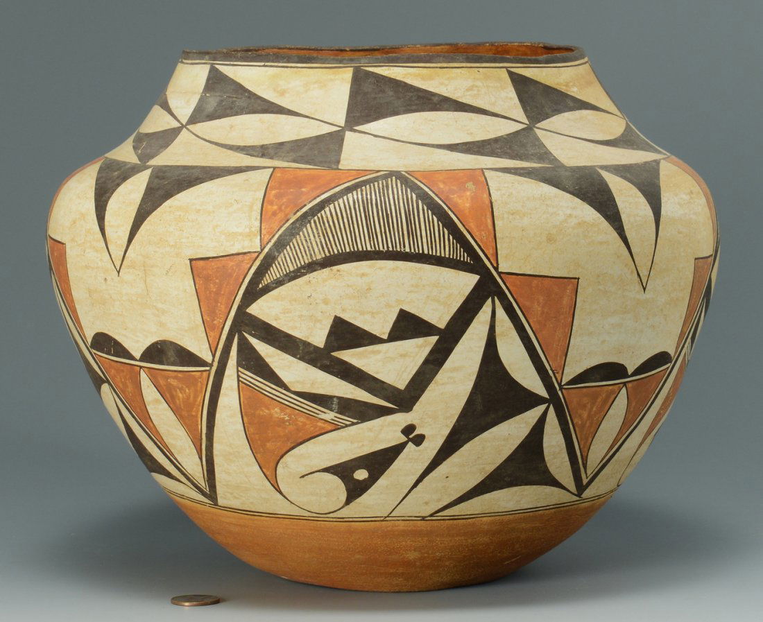 Native American Zia Olla Jar: Zia Pueblo pottery olla with polychrome decoration, triangular geometric and arched designs, 8 1/2" H x 9-3/4" dia. Circa 1920-1930.