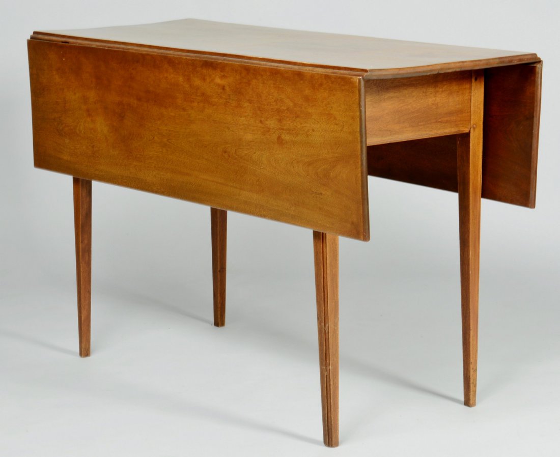 Hepplewhite Dropleaf Table: Dropleaf walnut Hepplewhite table with pegged construction. Two plain hinged drop leaves and four square tapered legs, molded edge at outside of legs and skirt. 28"H x 42"W x 18"D (42" with leaves ext