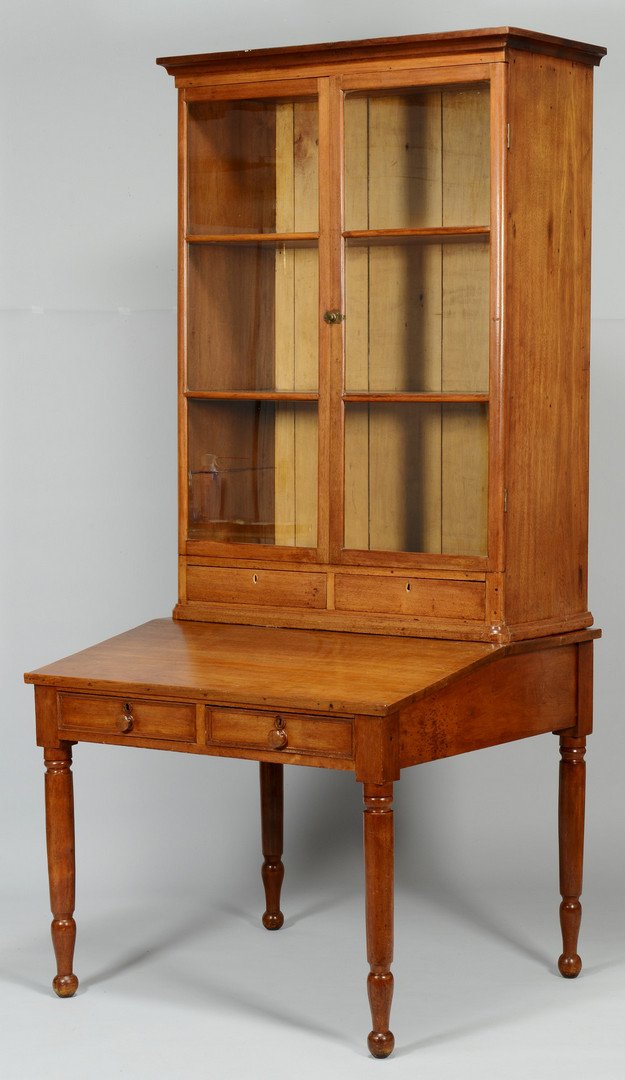 Middle TN Desk & Bookcase: Middle Tennessee Sheraton walnut desk and bookcase or "plantation desk," Davidson County, with poplar secondary. Two part construction. Upper section with ogee cornice over two triple-pane glazed door