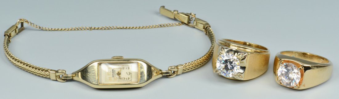 2 Rings and 1 Watch, 18K & 14K: Two gents gold and faux diamond rings including one 18k ring with smooth finish (12.9 grams, size 10) and one 14k with satin finish (19.1 grams, size 9); along with one 14k yellow gold lady's Gruen wr