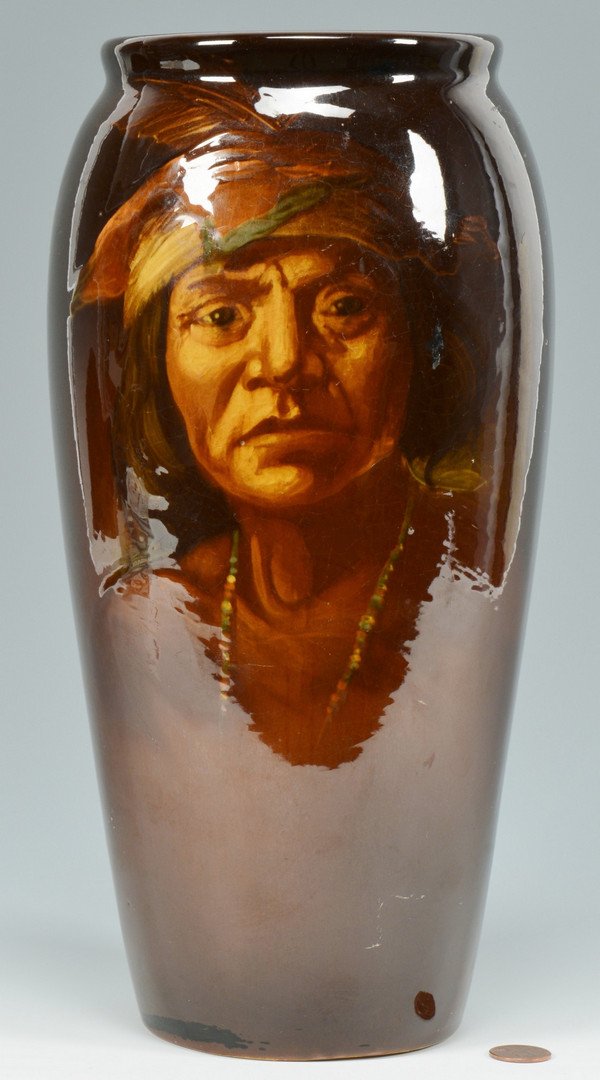 Weller Pottery Indian Vase: Louwelsa Weller pottery vase with hand painted image of a Native American male. Stamp on base partially legible. 12 1/4" H.