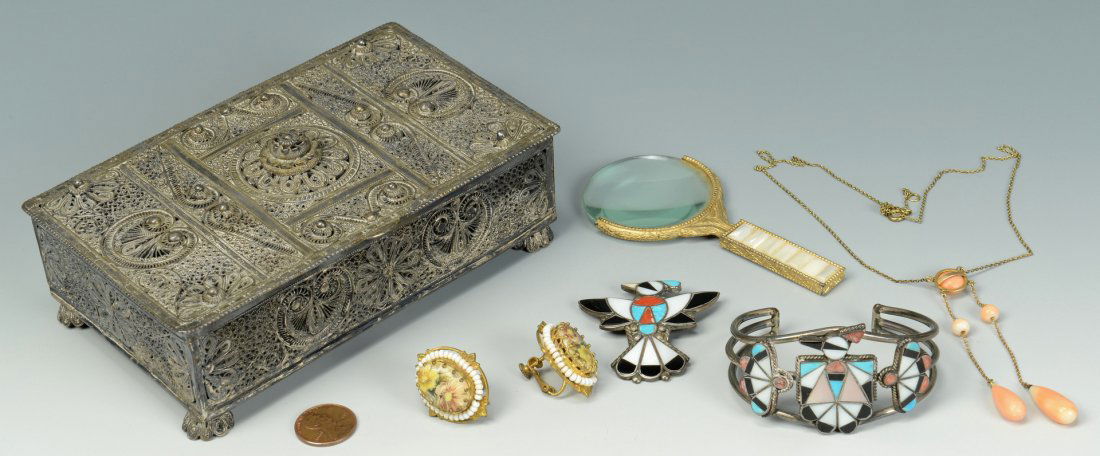 Silver filigree box with Jewelry: Middle Eastern filigree box with assorted jewelry contents including: 1 pair of signed Miriam Haskell earrings with hand painted floral porcelain centers, surrounded by white beads, with pierced gold-