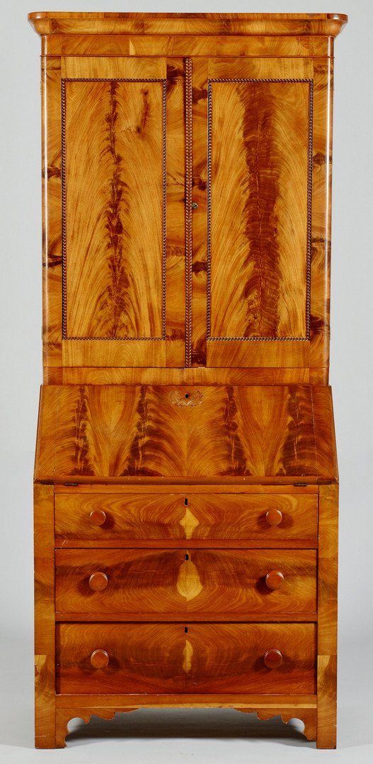 Small Late Classical Secretary Bookcase, prob. Ohio: Dimunitive American late Classical secretary bookcase, probably Ohio, figured mahogany veneers and cherry, in two parts, the ogee cornice over a pair of paneled doors with beaded edges, the base with 