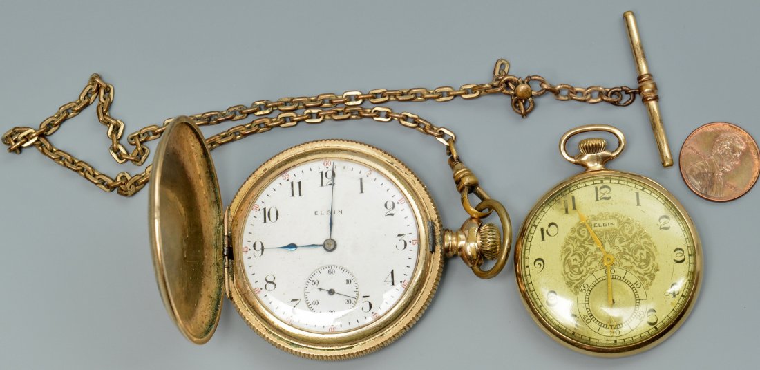 2 Elgin Pocket Watches: Two Elgin pocket watches. 1st item: One 14k yellow gold pocket watch with gold embossed face with second dial. case #5001285, PAT. OCT. 9 17. A cutout photograph of a young child is glued on the insid