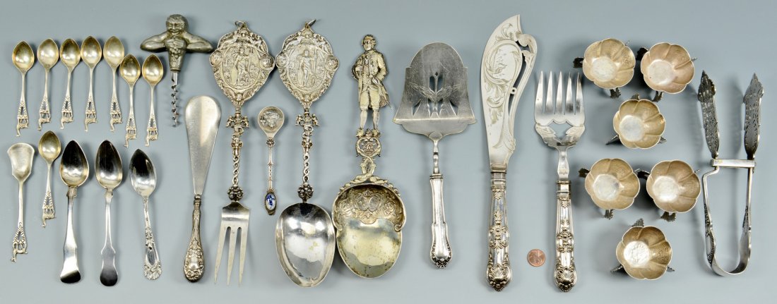22 pcs flatware inc. Hanau & 6 salts: 22 pieces of assorted flatware including Hanau silver, and 6 Mexican salt cellars. Tripod salt cellars feature lobed bodies engraved with various Southwestern symbols, flowers, and figures, and are ma
