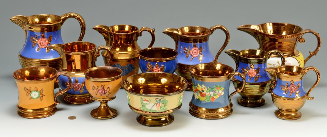 Group of English Copper Lusterware: Large group of English copper lusterware (12 items) including seven pitchers of various heights, two chalices, two mugs and one footed bowl. One pitcher has a hand-painted mother and child scene, all 
