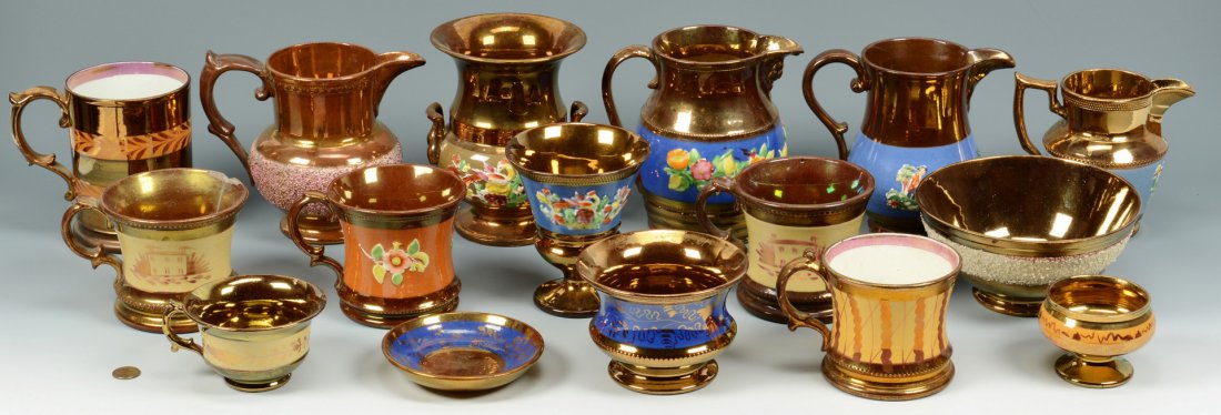 Group of English Copper Lusterware: Large group of English copper lusterware (16 items) including four pitchers, one urn, two footed bowls, one cup and saucer, five mugs, one open salt, one chalice, all with various decoration: applied 