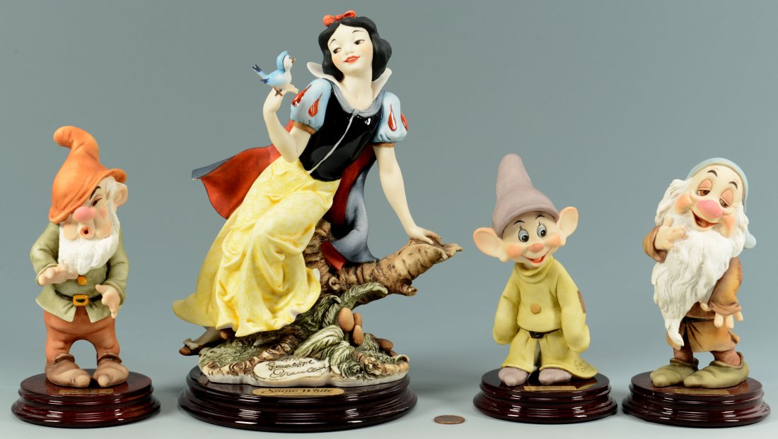 4 Giuseppe Armani Snow White Figures: A group of four Walt Disney Giuseppe Armani Florence Sculpture d'Arte Snow White porcelain figures including Snow White (#209C), Sleepy (#915C), Sneezy (#914C) and Dopey (#200C), all signed and dated.