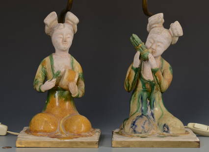 Pr. Chinese Musical Figure Lamps: Pair of Chinese partially glazed pottery female figures, manner of Tang Dynasty, each figure modeled in a kneeling posture, holding a musical instrument. The figures have been set into a metal frame