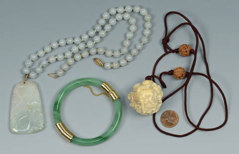 Group of Jade Jewelry & Other: Grouping of jade jewelry and other Asian items. 1st item: Chinese carved ivory zodiac ball mounted as a necklace with two carved wooden beads on brown cord. 16" L. Early 20th century. 2nd item: Jade