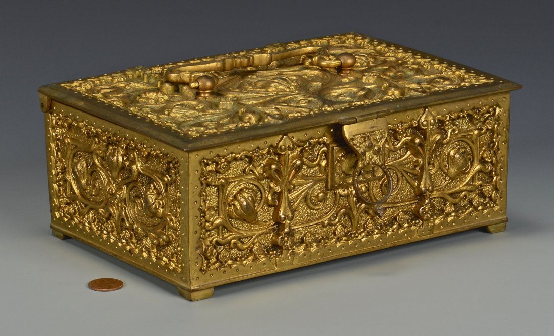 Erhard & Sohne Jewelry Box: Gilt bronze jewelry casket with Art Nouveau floral decoration, lift latch and velvet lining, stamped on bottom with the mark of Erhard and Sohne of Germany. 3-1/4"H x 9"W x 6"D. Early 20th century.